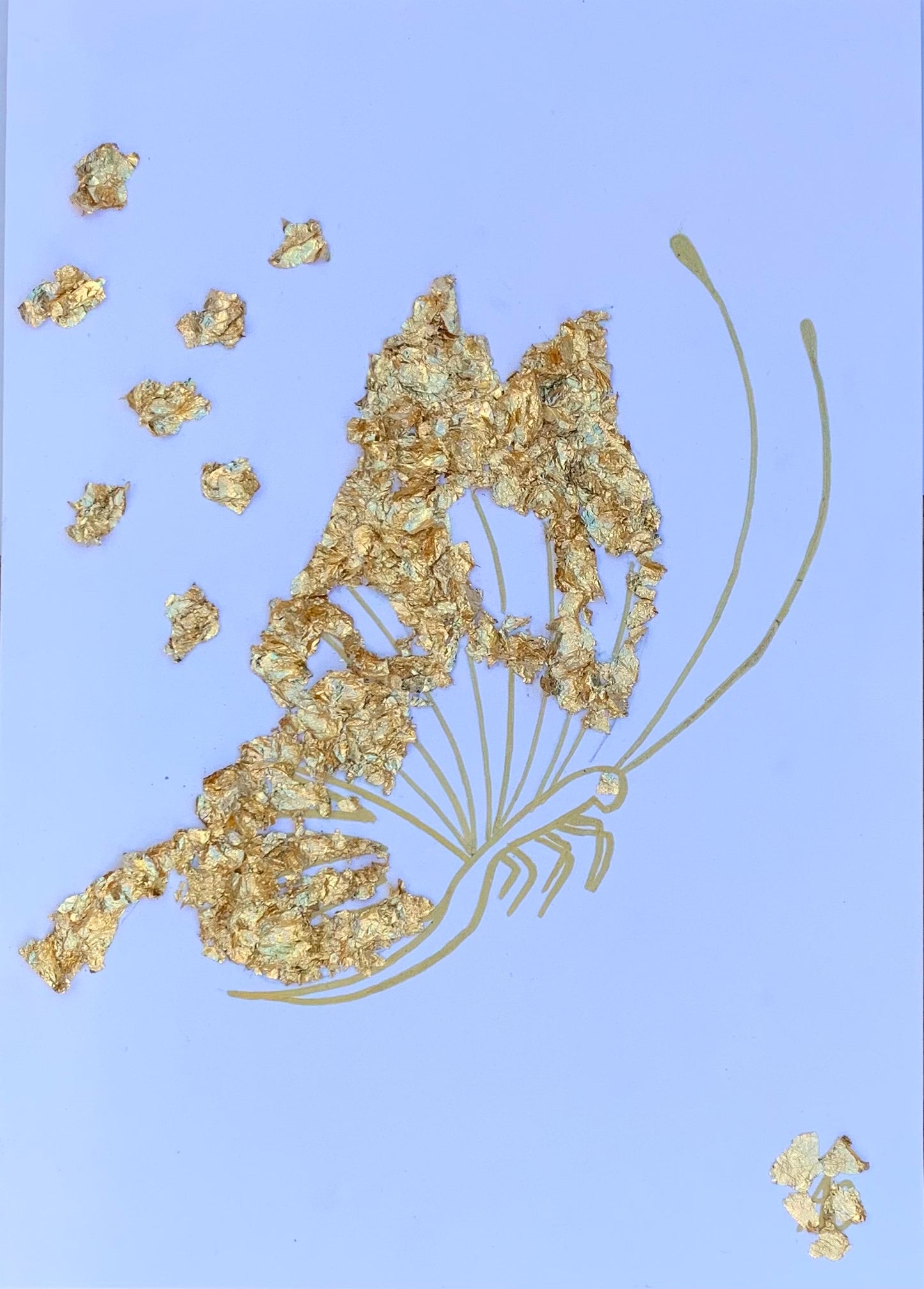 Un papillon réalisé en feuille d'or